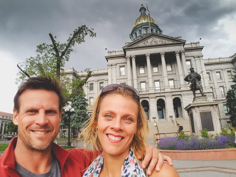 Husband and wife in front of City Hall in Denver.