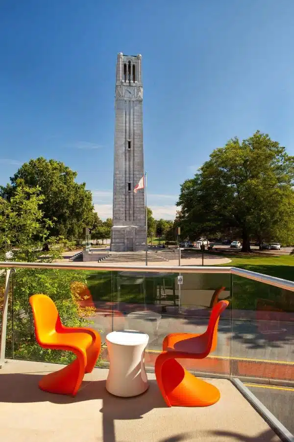 Two chairs overlooking a University belltower.
