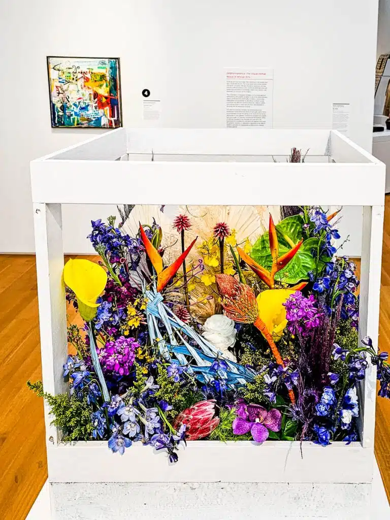 flowers in wooden frame in art gallery