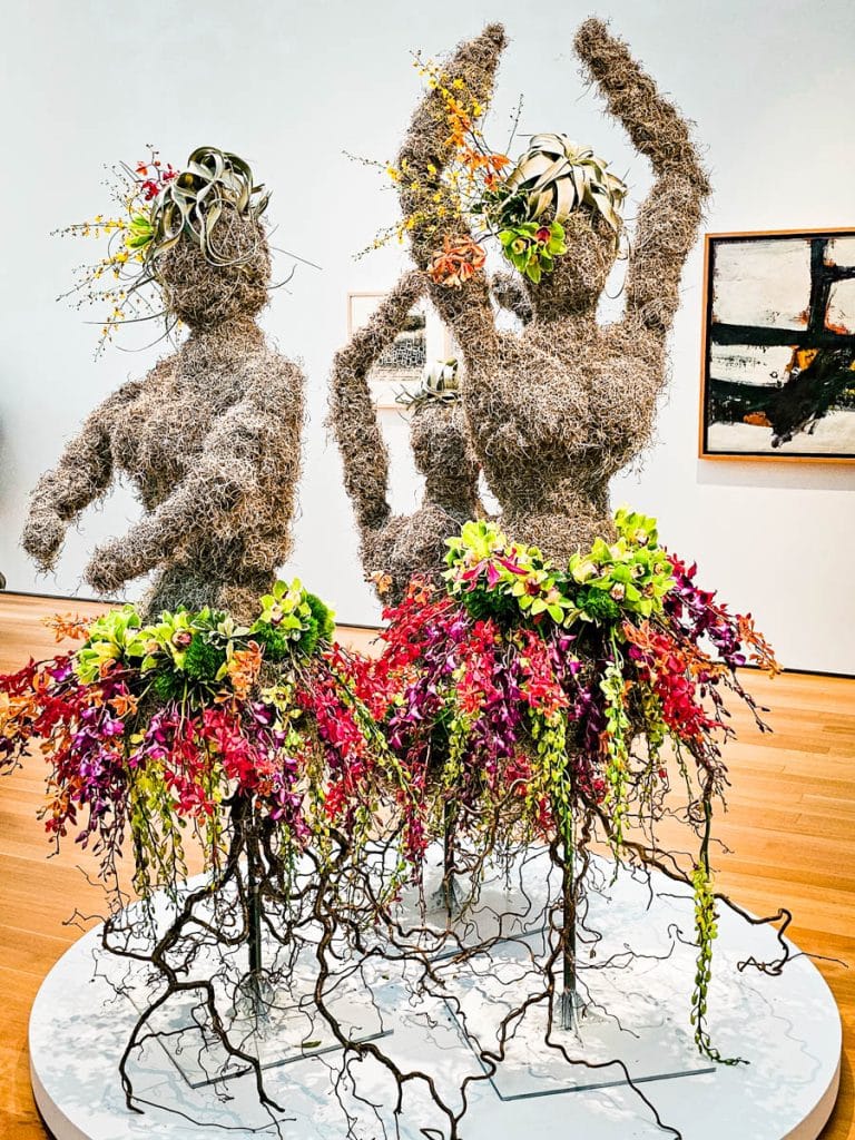 stick dancing figures with tutus made from flowers
