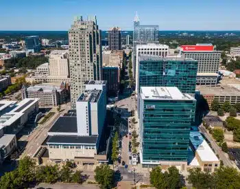 Aerial view of a city and its buildings and streets in Raleigh, NC.