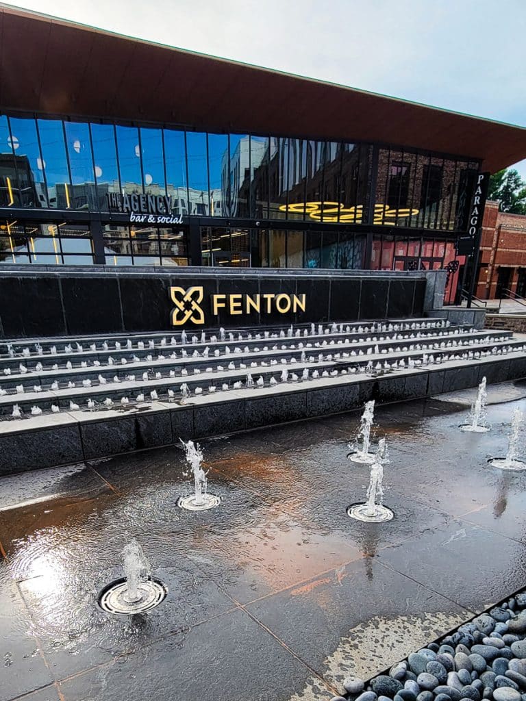 Fountains in front of a building with the name Fenton.