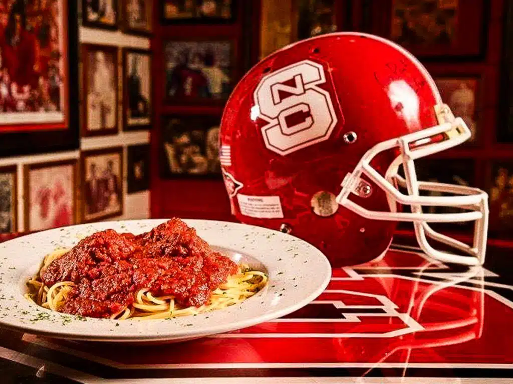 Bowl of pasta and a football helmet.
