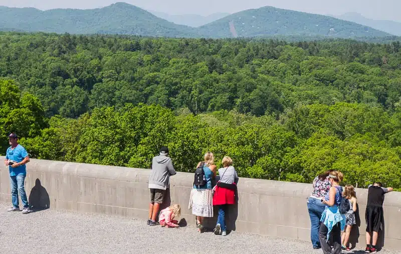 people looking at pisgah forest view from biltmore house