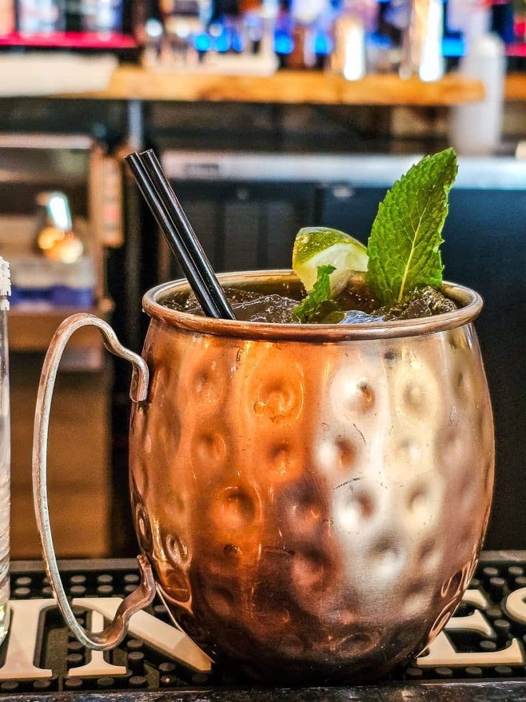 Cocktail in a mug on a bar.
