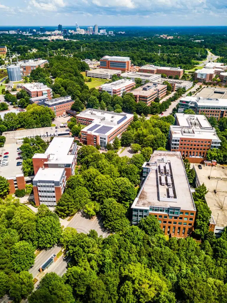 Buildings on a university campus surrounded by trees.