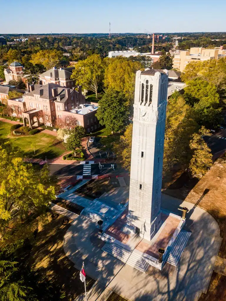 A belltower memorial on a university campus.