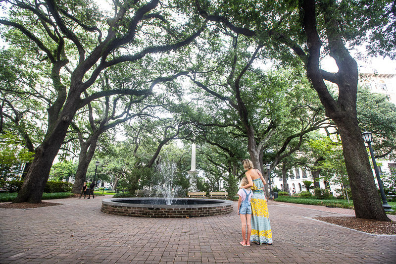 woman and child looking at fountain in forsyth park savannah