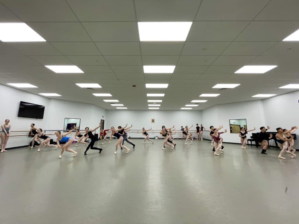 Ballet dancers practicing in a studio for Cary Ballet.