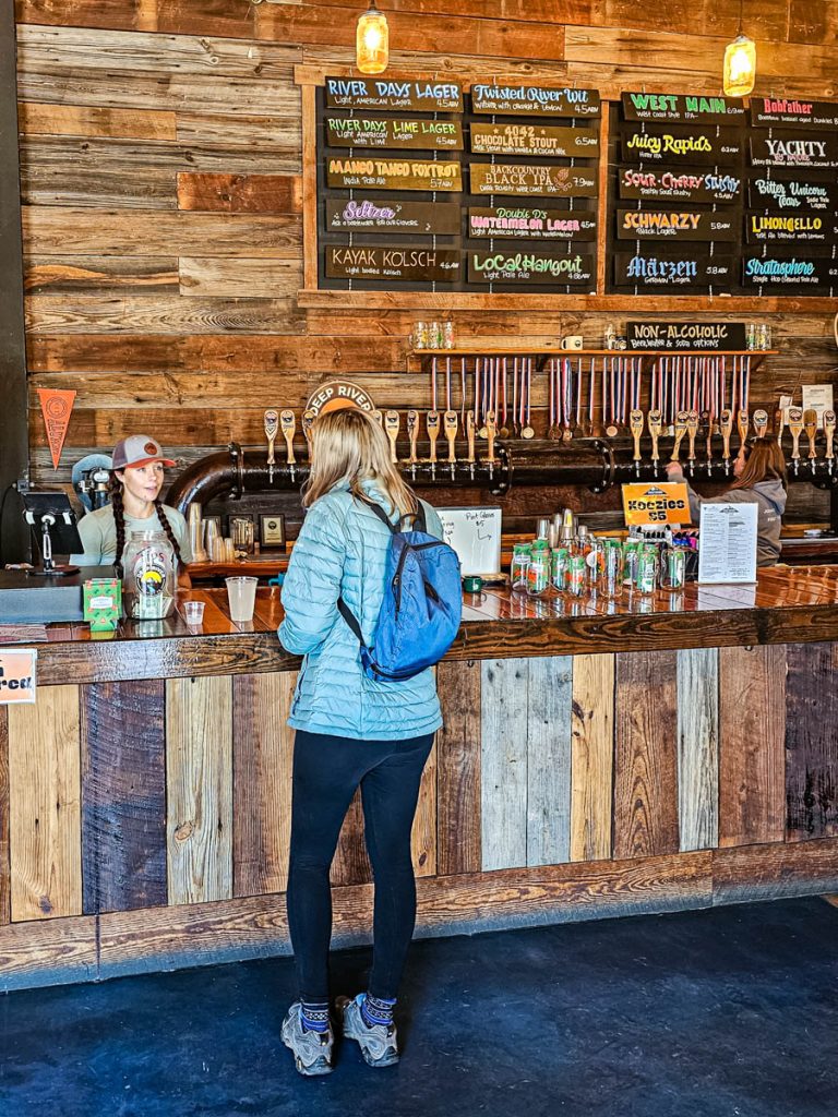 lady at counter of deep river brewery