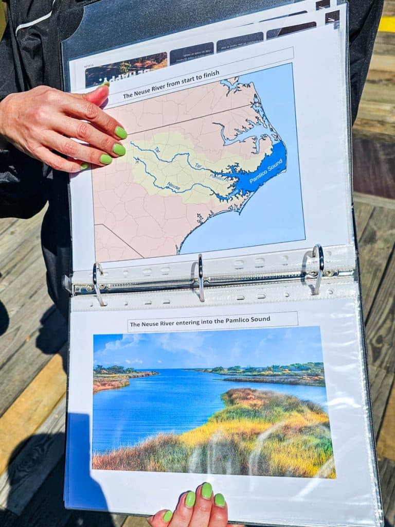 person holding up map of mountains to sea trail
