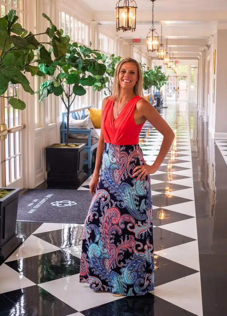 woman standing in hallway of carolina inn