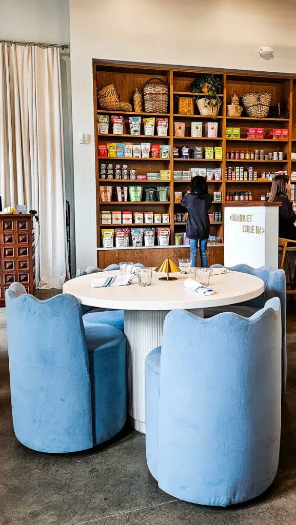 good graces interior showing tables and market shelves