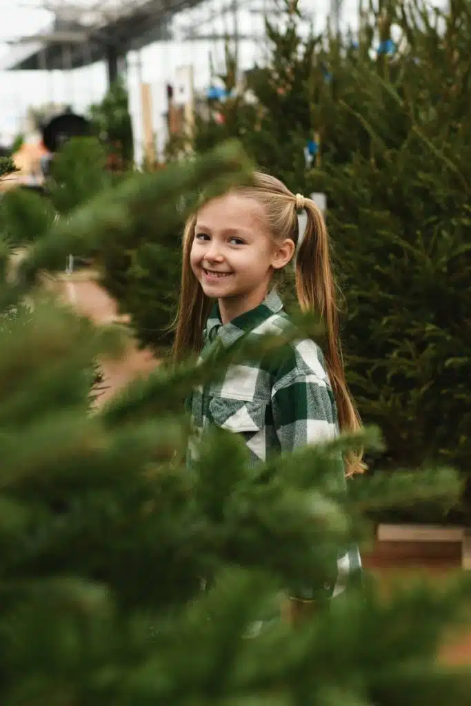 little girl at christmas tree farm