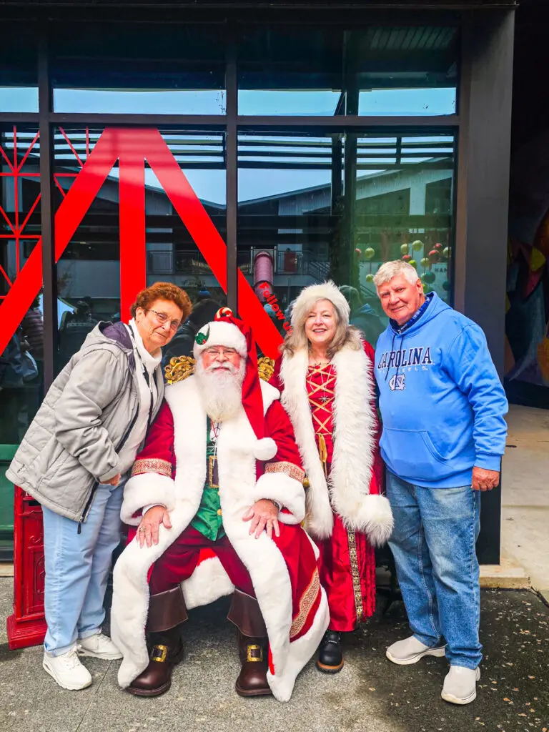 family posing with santa