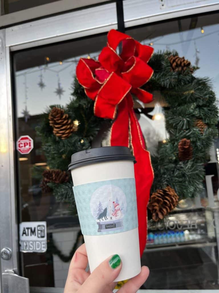 person holding coffee cup