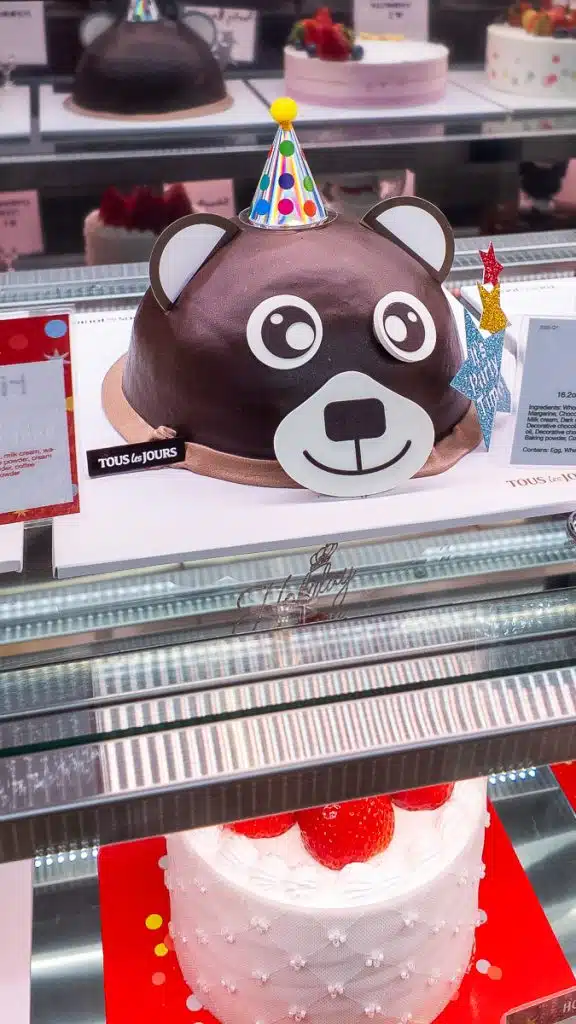 party cake in display at tous les jours bakery