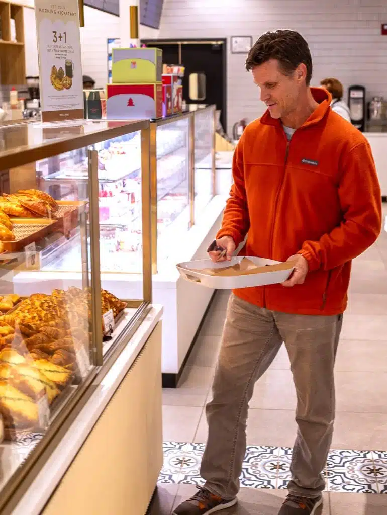 man serving himself at tous les jours bakery