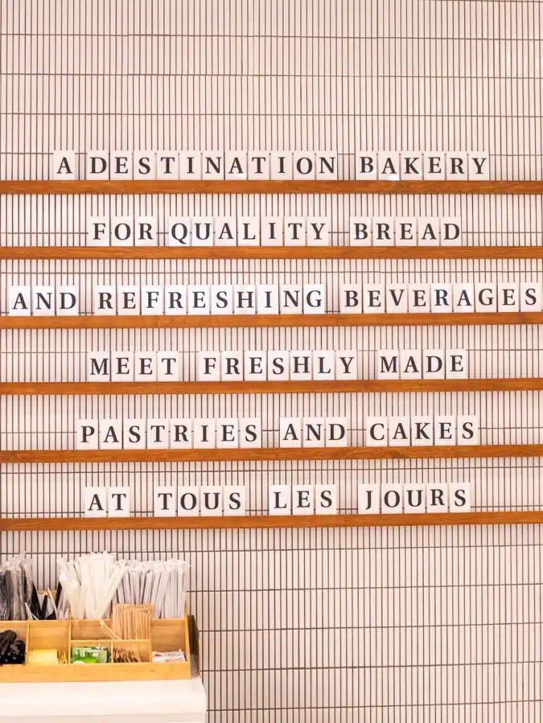sign on tous les jours bakery wall
