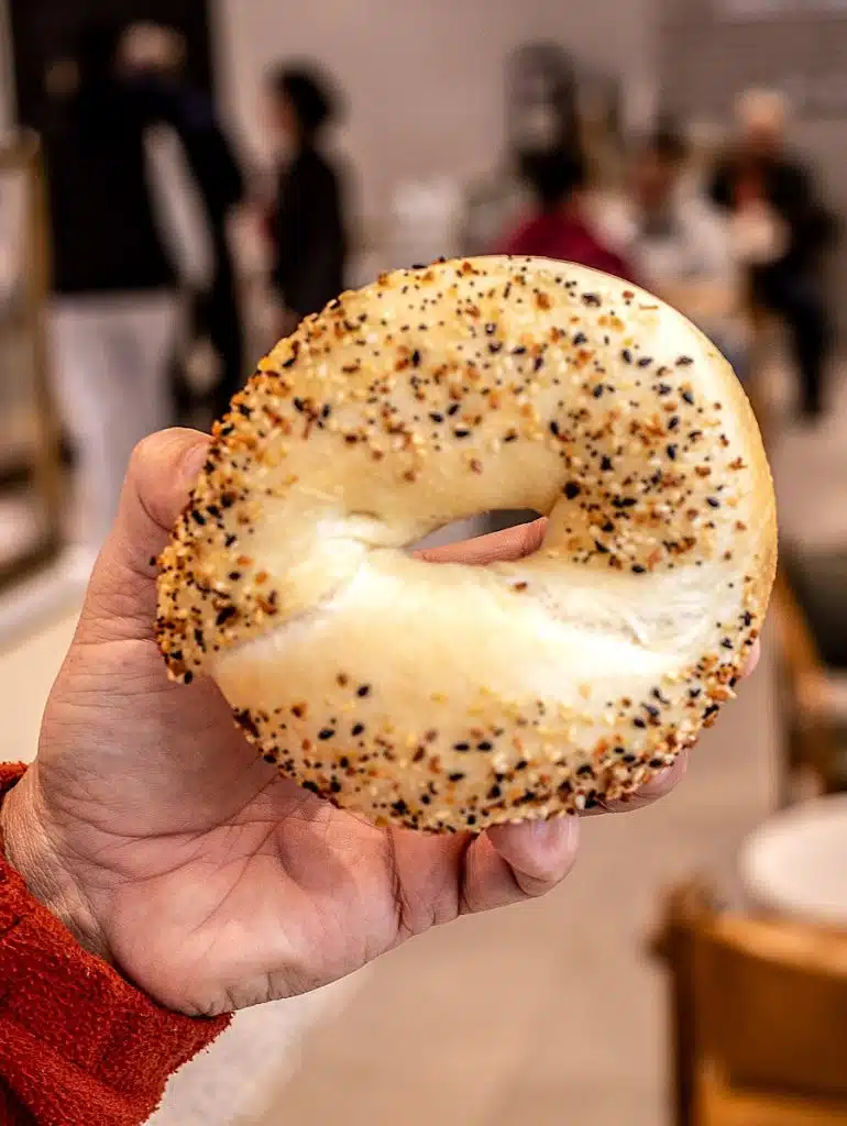 man holding cloud bagel
