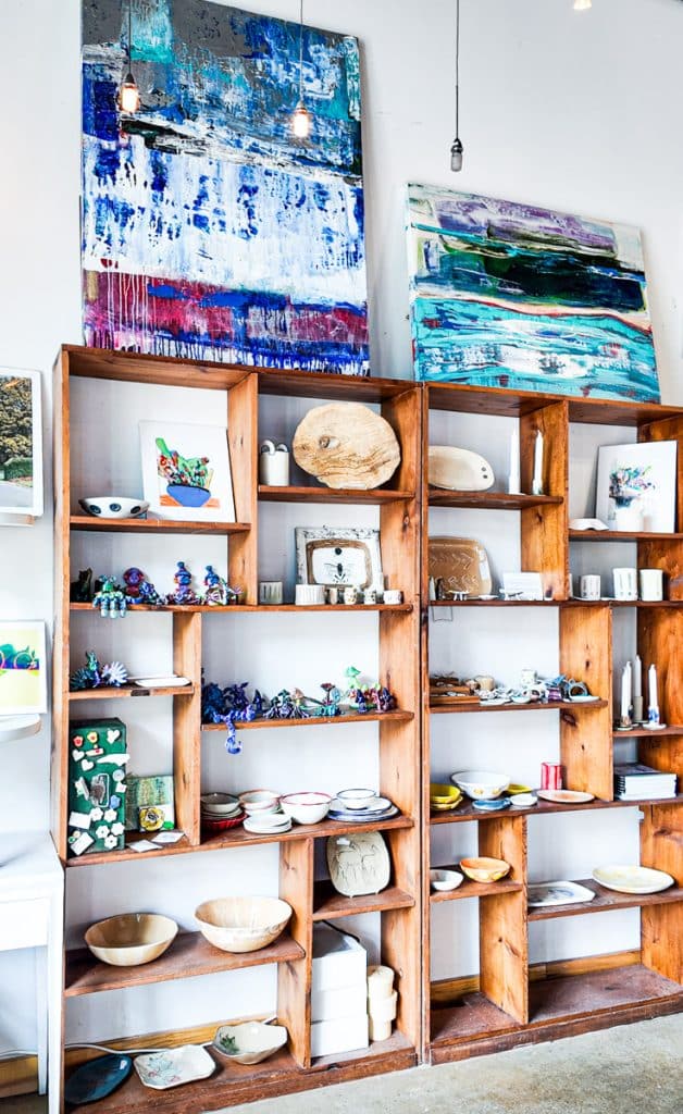 shelves with art work on them in lucky tree