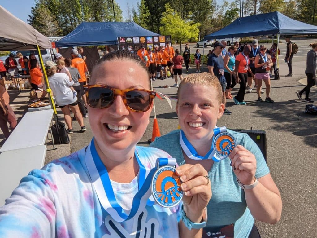 happy runners with their medals