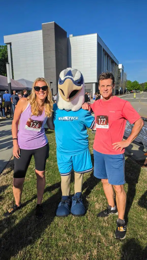 couple with wake tech mascot
