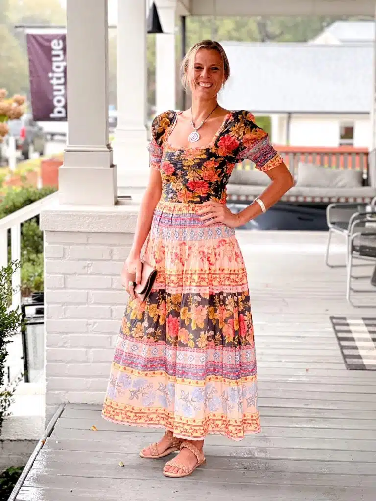 woman in bright patterned dress from rose and leepine
