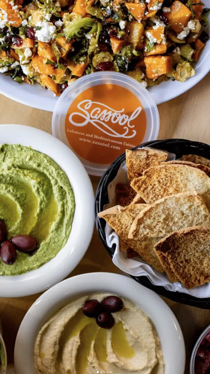 table with bowls of hummus