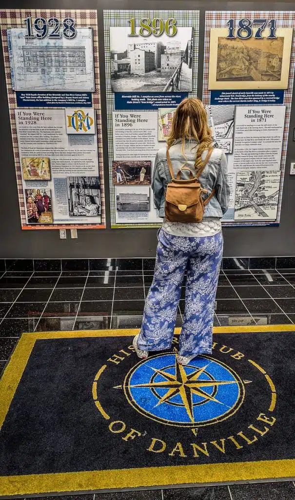 woman looking at exhibitions in the history hub danville