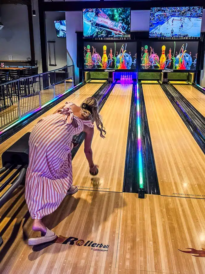 woman playing mini bowls