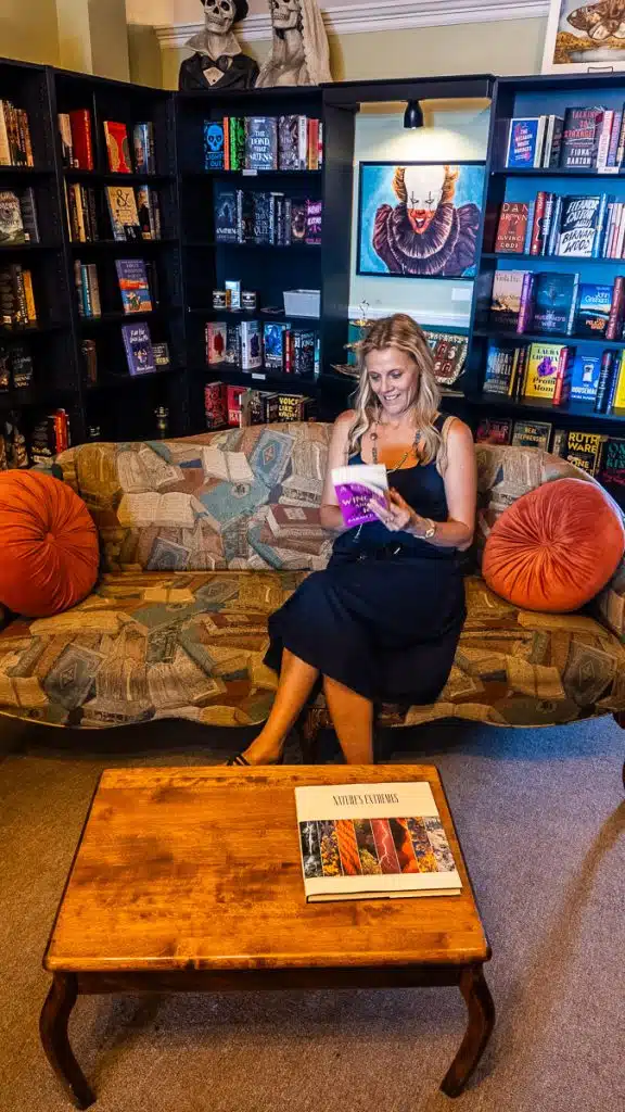 woman reading book in dog eared page bookstore danville