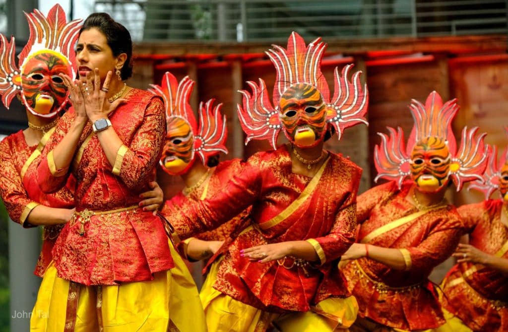 people om stage in masked costumes for diwali