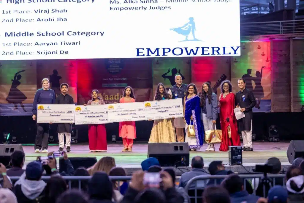 students on stage at diwali accepting youth achievement awards